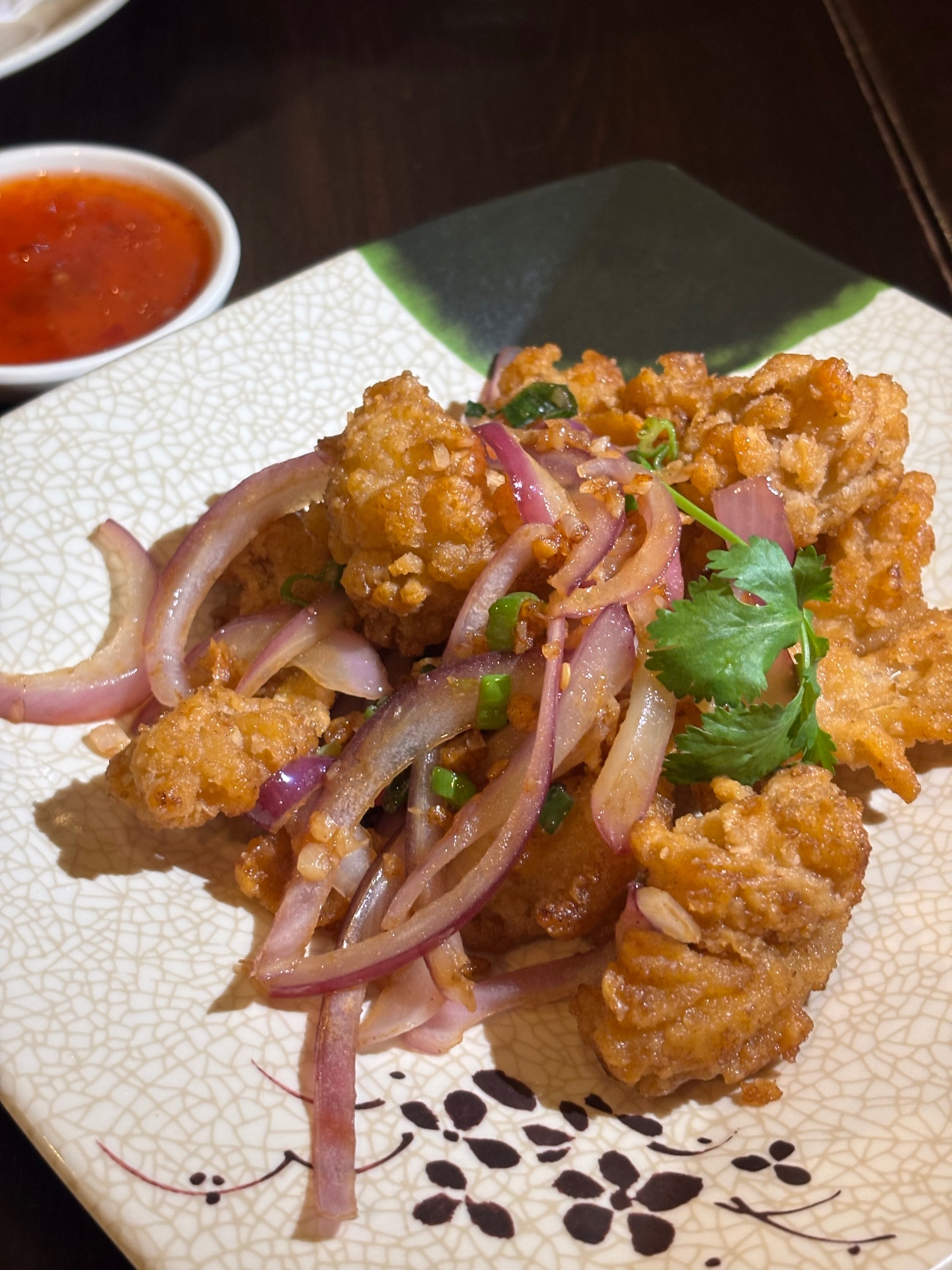 Salt and pepper fried squid with red onion